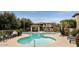 Inviting community pool with plenty of lounge chairs and shaded seating areas at 3330 S Gilbert Rd # 2090, Chandler, AZ 85286
