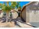Inviting front entrance with a well-maintained walkway, desert landscape, and neutral-toned exterior at 3544 E Tonto Ln, Phoenix, AZ 85050