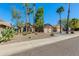 Charming single-story home featuring desert landscaping, mature trees, and a two-car garage at 3544 E Tonto Ln, Phoenix, AZ 85050