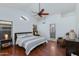Spacious main bedroom with hardwood floors, ceiling fan, and ensuite bathroom at 3544 E Tonto Ln, Phoenix, AZ 85050