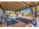 Cozy covered patio featuring comfortable seating and view of a sparkling pool at 3544 E Tonto Ln, Phoenix, AZ 85050