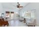 Inviting sun room featuring tile floors, a ceiling fan, and plenty of natural light at 3544 E Tonto Ln, Phoenix, AZ 85050