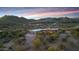 Expansive desert estate with stunning mountain views, mature trees, and a private drive leading to the home at 36190 N Creek View Ln, Cave Creek, AZ 85331