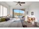 Serene bedroom with sliding door to pool area, mountain views, and a desk area at 36190 N Creek View Ln, Cave Creek, AZ 85331