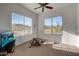 Bright exercise room with mountain views, ceiling fan, and an exercise machine at 36190 N Creek View Ln, Cave Creek, AZ 85331
