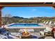 A luxurious outdoor living space with a pool, fire pit, and stunning mountain views for relaxation and entertainment at 36190 N Creek View Ln, Cave Creek, AZ 85331