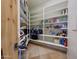 Walk-in pantry with adjustable shelving, providing ample storage for groceries and supplies at 36190 N Creek View Ln, Cave Creek, AZ 85331