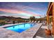 An inviting pool surrounded by lounge chairs, offering a tranquil oasis with picturesque mountain scenery at 36190 N Creek View Ln, Cave Creek, AZ 85331
