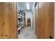 Storage room with wooden doors and built-in shelves for efficient organization at 36190 N Creek View Ln, Cave Creek, AZ 85331