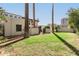 A well manicured backyard features mature landscaping and trees, plus a privacy wall at 374 E Verde Ln, Phoenix, AZ 85012