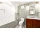 Charming bathroom featuring decorative tiling, modern vanity, and shower-tub combination at 374 E Verde Ln, Phoenix, AZ 85012