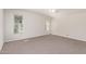 Bedroom features neutral paint, carpet, and lots of natural light from the large windows at 374 E Verde Ln, Phoenix, AZ 85012