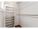 A closet is equipped with a shelving unit and a closet rod for optimal storage and organization at 374 E Verde Ln, Phoenix, AZ 85012