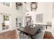 Dining room with oversized windows and view into the kitchen at 374 E Verde Ln, Phoenix, AZ 85012