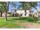 Captivating front exterior of a home with well-kept lawn and mature palm trees at 374 E Verde Ln, Phoenix, AZ 85012