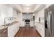 Bright kitchen featuring stainless steel appliances, subway tile backsplash, and granite countertops at 374 E Verde Ln, Phoenix, AZ 85012