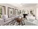 Stylish living room showcasing neutral furnishings, hardwood floors, and an elegant ceiling fan at 374 E Verde Ln, Phoenix, AZ 85012