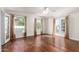 Bright living room with hardwood floors, French doors, and large windows with natural light at 374 E Verde Ln, Phoenix, AZ 85012