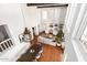 Open-concept living room and dining area with hardwood floors and plenty of natural light at 374 E Verde Ln, Phoenix, AZ 85012