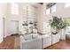 Bright living room with floor to ceiling bookshelves and an abundance of natural light at 374 E Verde Ln, Phoenix, AZ 85012