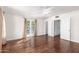 Spacious bedroom features hardwood floors, neutral paint, and French doors to a balcony at 374 E Verde Ln, Phoenix, AZ 85012