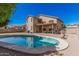 Stunning backyard view highlighting the pool, patio, and the home's exterior with ample space for entertaining at 3875 E Juanita Ave, Gilbert, AZ 85234