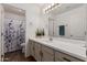 Bright bathroom with a large mirror, spacious vanity with a white countertop, and a shower and toilet at 3875 E Juanita Ave, Gilbert, AZ 85234