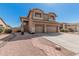 Charming two-story home featuring a three-car garage and beautiful desert landscaping at 3875 E Juanita Ave, Gilbert, AZ 85234