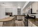 An alternate view of the bright kitchen with stainless steel appliances and granite countertops at 3875 E Juanita Ave, Gilbert, AZ 85234