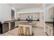 Well-equipped kitchen features stone countertops, modern appliances, and a functional center island at 3875 E Juanita Ave, Gilbert, AZ 85234
