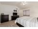 The primary bedroom features a large dresser with an adjacent wall-mounted TV at 3875 E Juanita Ave, Gilbert, AZ 85234