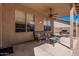 Cozy covered patio with comfortable seating and a ceiling fan, perfect for relaxing outdoors at 3875 E Juanita Ave, Gilbert, AZ 85234