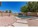Backyard pool area surrounded by brick and rock, perfect for outdoor enjoyment on a sunny day at 3875 E Juanita Ave, Gilbert, AZ 85234