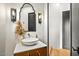 Bathroom featuring an ornate mirror, vessel sink, and modern fixtures at 39912 N 98Th Way, Scottsdale, AZ 85262