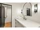 Modern bathroom featuring a sleek vanity and stylish lighting fixtures at 39912 N 98Th Way, Scottsdale, AZ 85262