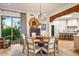 Dining room featuring hardwood floors, modern chandelier, and desert view at 39912 N 98Th Way, Scottsdale, AZ 85262