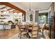 Dining room with wood beams, hardwood floors, and view to the outdoor living space at 39912 N 98Th Way, Scottsdale, AZ 85262
