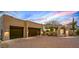 Luxury home featuring a three car garage, desert landscaping, and beautiful sunset views at 39912 N 98Th Way, Scottsdale, AZ 85262