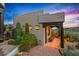 Southwestern home featuring desert landscaping, a covered patio, and stunning sunset views at 39912 N 98Th Way, Scottsdale, AZ 85262