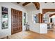 Bright foyer featuring a solid wood door, hardwood floors and views into the dining area at 39912 N 98Th Way, Scottsdale, AZ 85262
