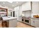 Bright kitchen with stainless steel Wolf appliances and quartz countertops at 39912 N 98Th Way, Scottsdale, AZ 85262