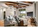 Well-lit living room with wood ceilings, mountain views, and open floor plan at 39912 N 98Th Way, Scottsdale, AZ 85262