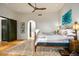 Main bedroom featuring hardwood floors and ensuite bath at 39912 N 98Th Way, Scottsdale, AZ 85262