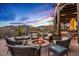 Outdoor space with cozy seating, a fire pit, and views of pool and desert landscaping for relaxing evenings at 39912 N 98Th Way, Scottsdale, AZ 85262