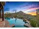 Stunning infinity pool and spa overlook a desert landscape, promising relaxation and breathtaking views at 39912 N 98Th Way, Scottsdale, AZ 85262
