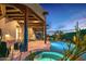 Outdoor oasis with a pool, spa, covered patios, and lush desert landscaping, perfect for relaxing and entertaining at 39912 N 98Th Way, Scottsdale, AZ 85262