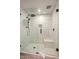 Modern bathroom with a walk-in shower and frameless glass enclosure at 39912 N 98Th Way, Scottsdale, AZ 85262