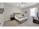 Comfortable bedroom showcasing a neutral color scheme, carpet flooring, and tasteful furnishings at 4013 N Founder Cir, Buckeye, AZ 85396