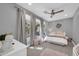 Cozy bedroom with plush carpet, ample natural light, a ceiling fan, and stylish décor at 4013 N Founder Cir, Buckeye, AZ 85396