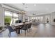 Open concept dining and living spaces with backyard access at 4013 N Founder Cir, Buckeye, AZ 85396
